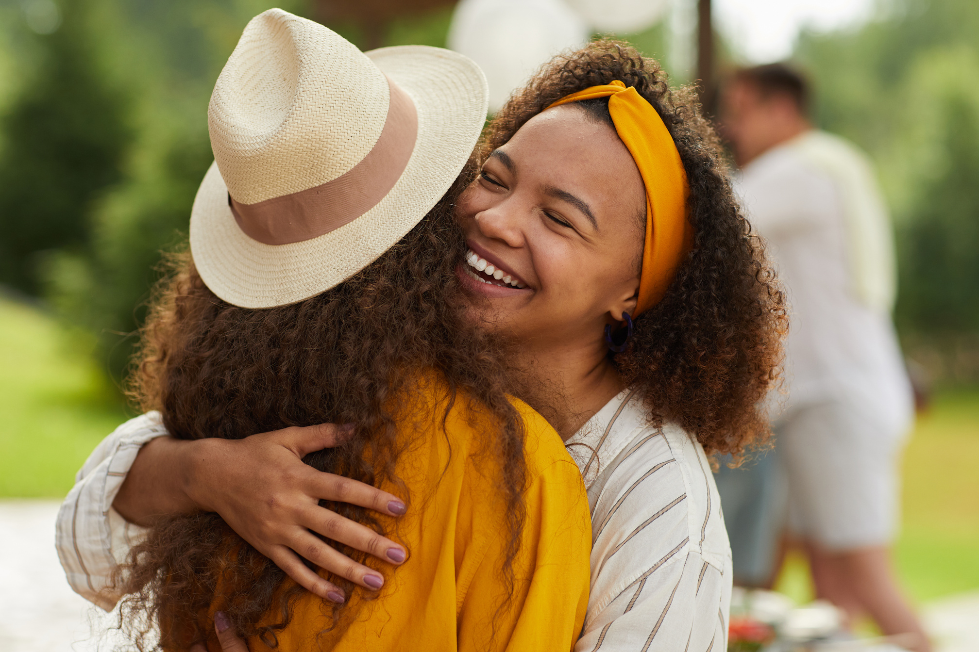 Friends Hugging at Social Gathering